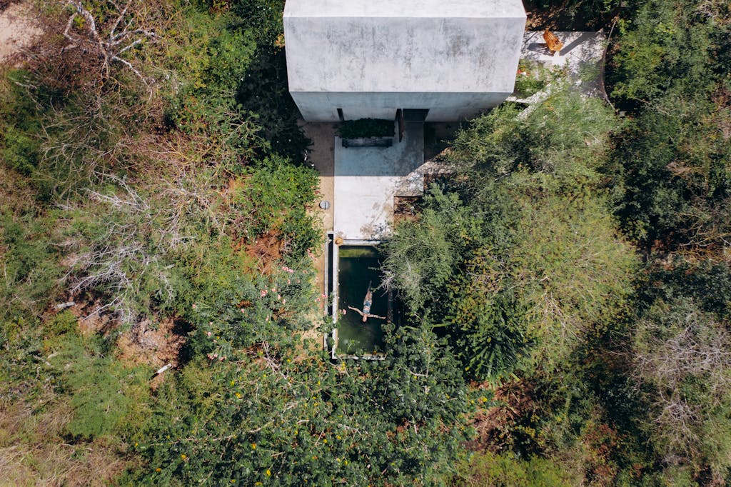 Gray Concrete Wall on Green Grass Field